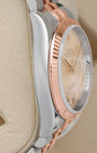 Side profile view of the polished 904L stainless steel Oyster case on the non-crown side of a two-tone Rolex Datejust 116231