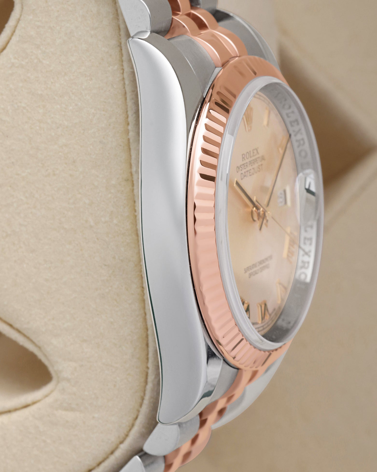 Side profile view of the polished 904L stainless steel Oyster case on the non-crown side of a two-tone Rolex Datejust 116231