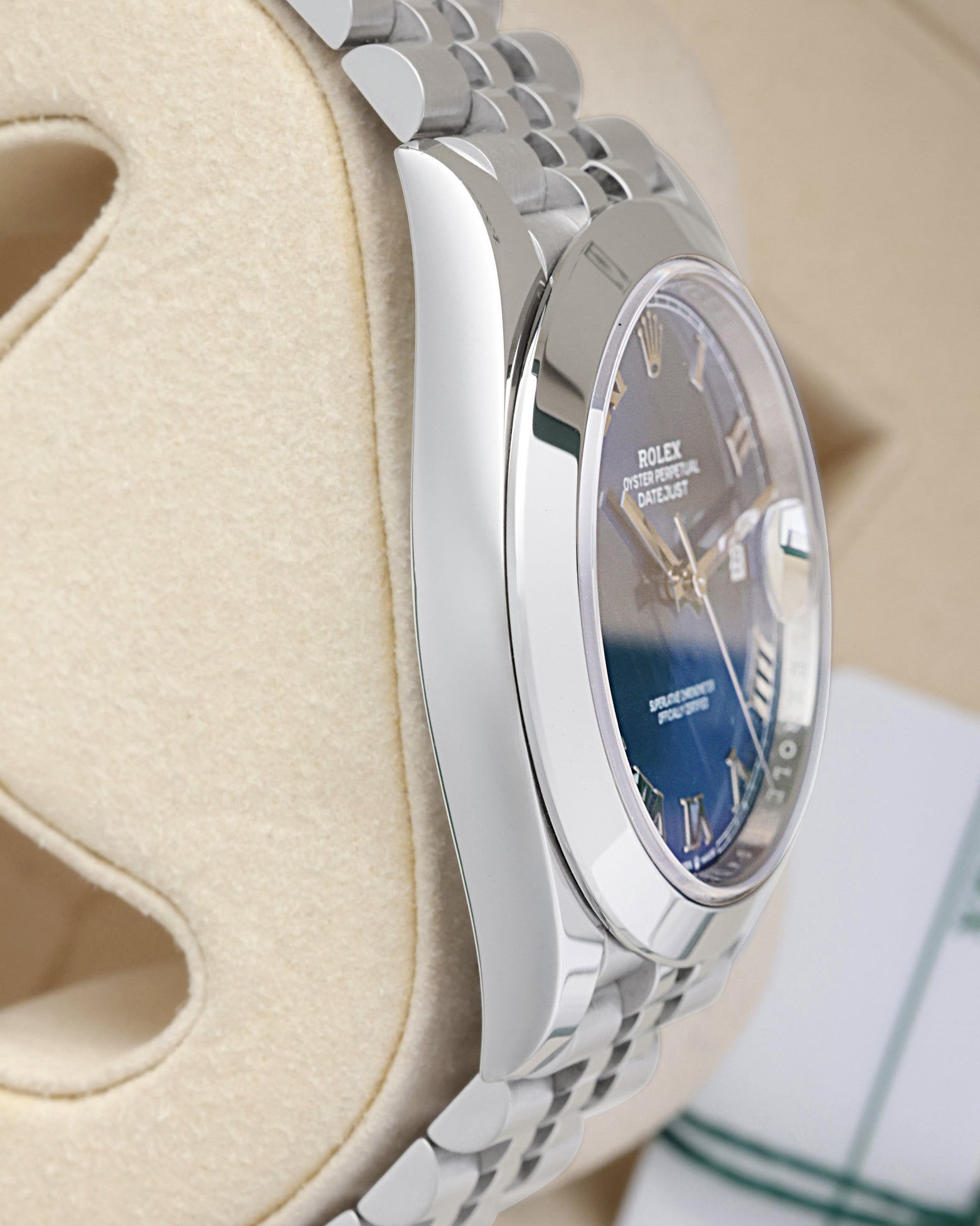 Side profile view of the polished 904L stainless steel Oyster case on the non-crown side of a Rolex Datejust 126300