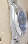 Side profile view of the polished and brushed 904L stainless steel Oyster case on the non-crown side of a Rolex 177200