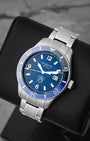 A high-angle three-quarter studio profile of the 41mm stainless steel Montblanc Iced Sea watch case resting on a black leather cushion to highlight its textured dial depth