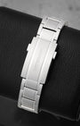 A rear view of the interchangeable three-link stainless steel bracelet focusing on the secure folding deployment clasp engraved with the traditional Montblanc script logo