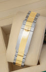 Two-tone 18k yellow gold and stainless steel Rolex Oyster bracelet featuring the folding Oysterlock safety clasp