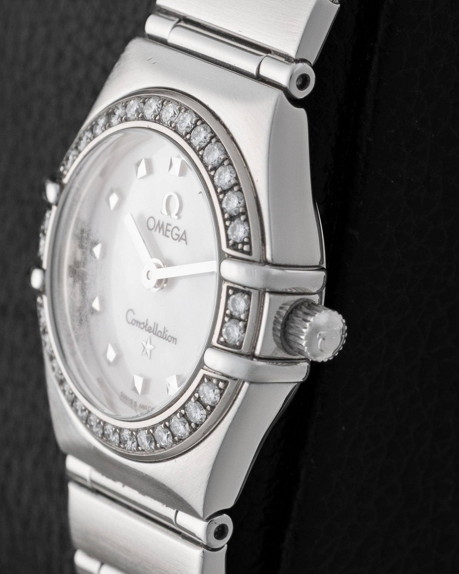 Right side profile view of the 26mm Omega Constellation 1465.71.00 showcasing the polished stainless steel case, diamond bezel detail, and winding crown.