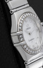 Left side profile view highlighting the signature bezel claws and thin stainless steel case design of the Omega Constellation 1465.71.00.