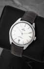 angled view of Omega De Ville Trésor with domed silver opaline dial and white gold hour markers