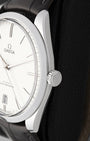 Close-up view of the polished crown on an Omega De Ville Trésor stainless steel case
