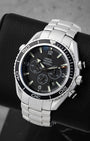 Angled view of Omega Planet Ocean 2210.50.00 displaying black chronograph sub-dials, orange accents, and black bezel