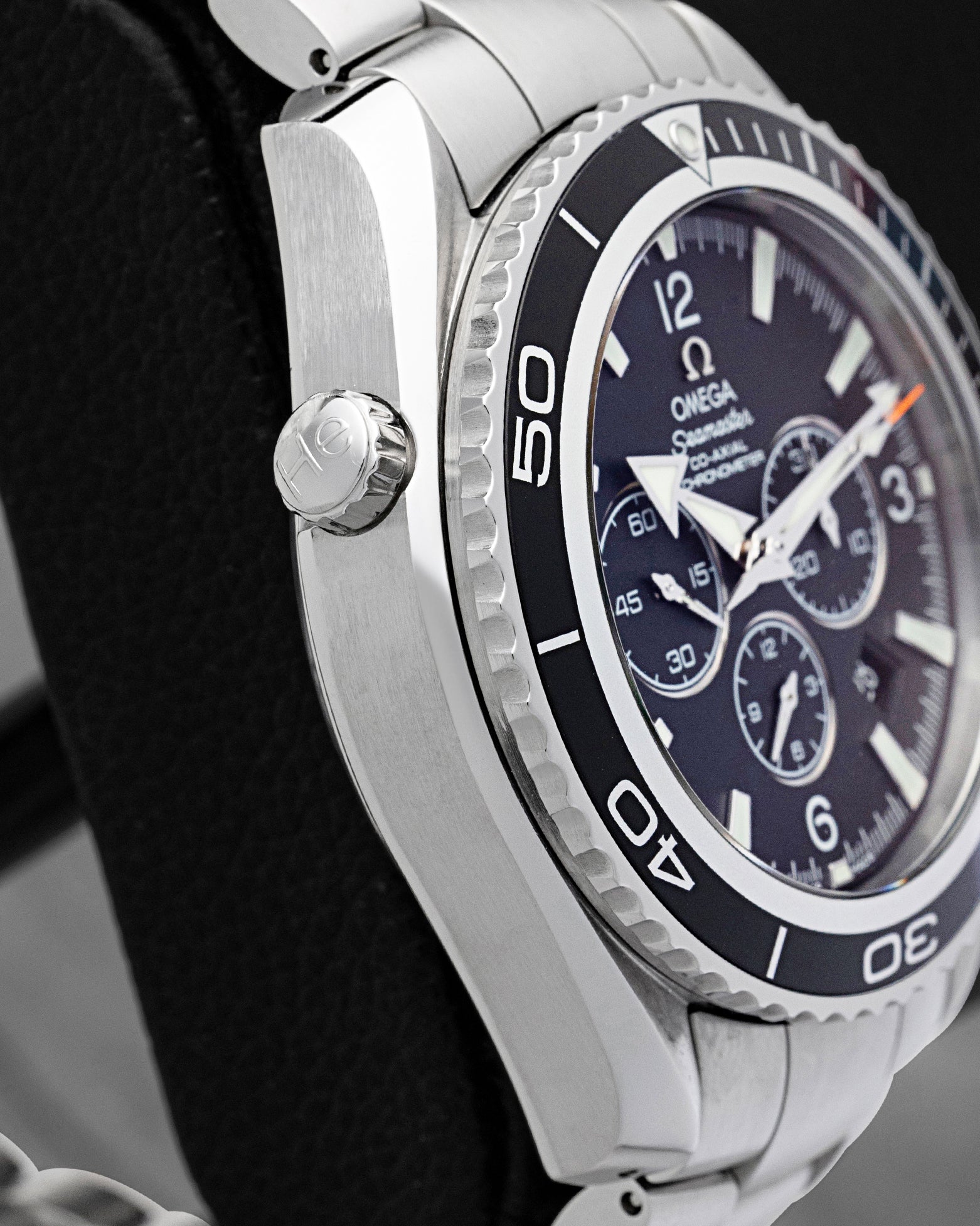 Side view showing the helium escape valve and thick steel case profile on Omega Seamaster Planet Ocean 600M