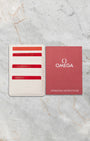Official Omega international warranty cards, Master Chronometer certificate, wallet, and operating instruction manual