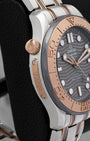 Side view of conical helium escape valve and 18k Sedna gold limited edition plaque on Omega Seamaster 300M