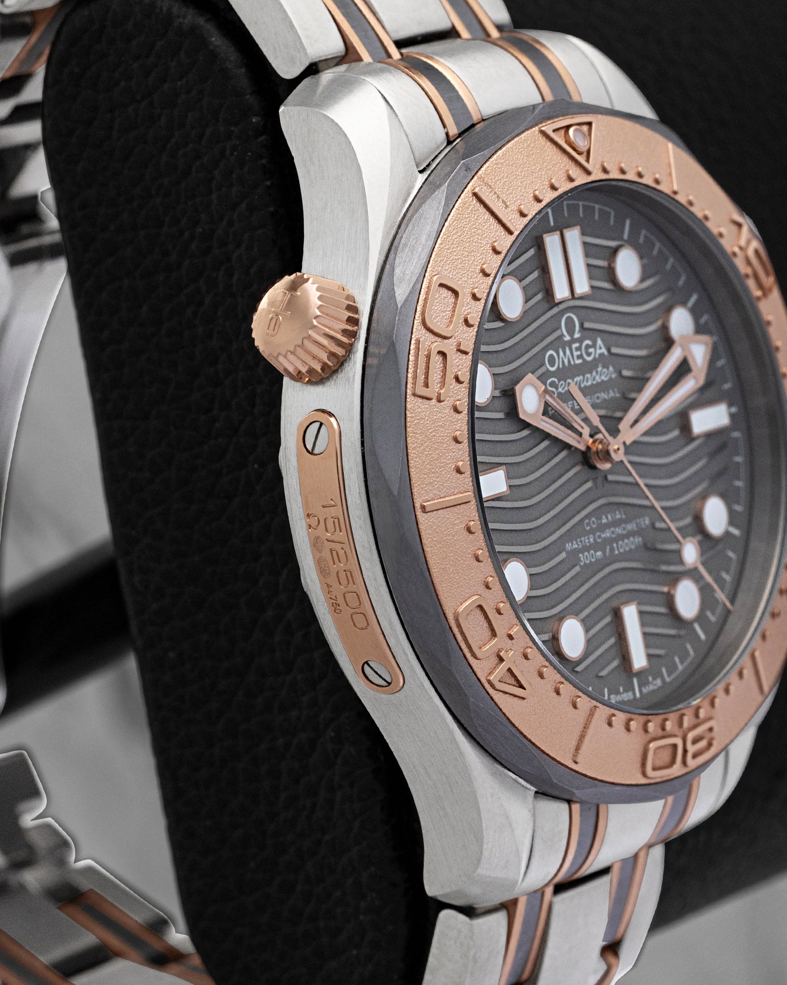 Side view of conical helium escape valve and 18k Sedna gold limited edition plaque on Omega Seamaster 300M