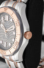 Side profile of 42mm titanium case featuring 18k Sedna gold screw-down crown and tantalum bezel ring