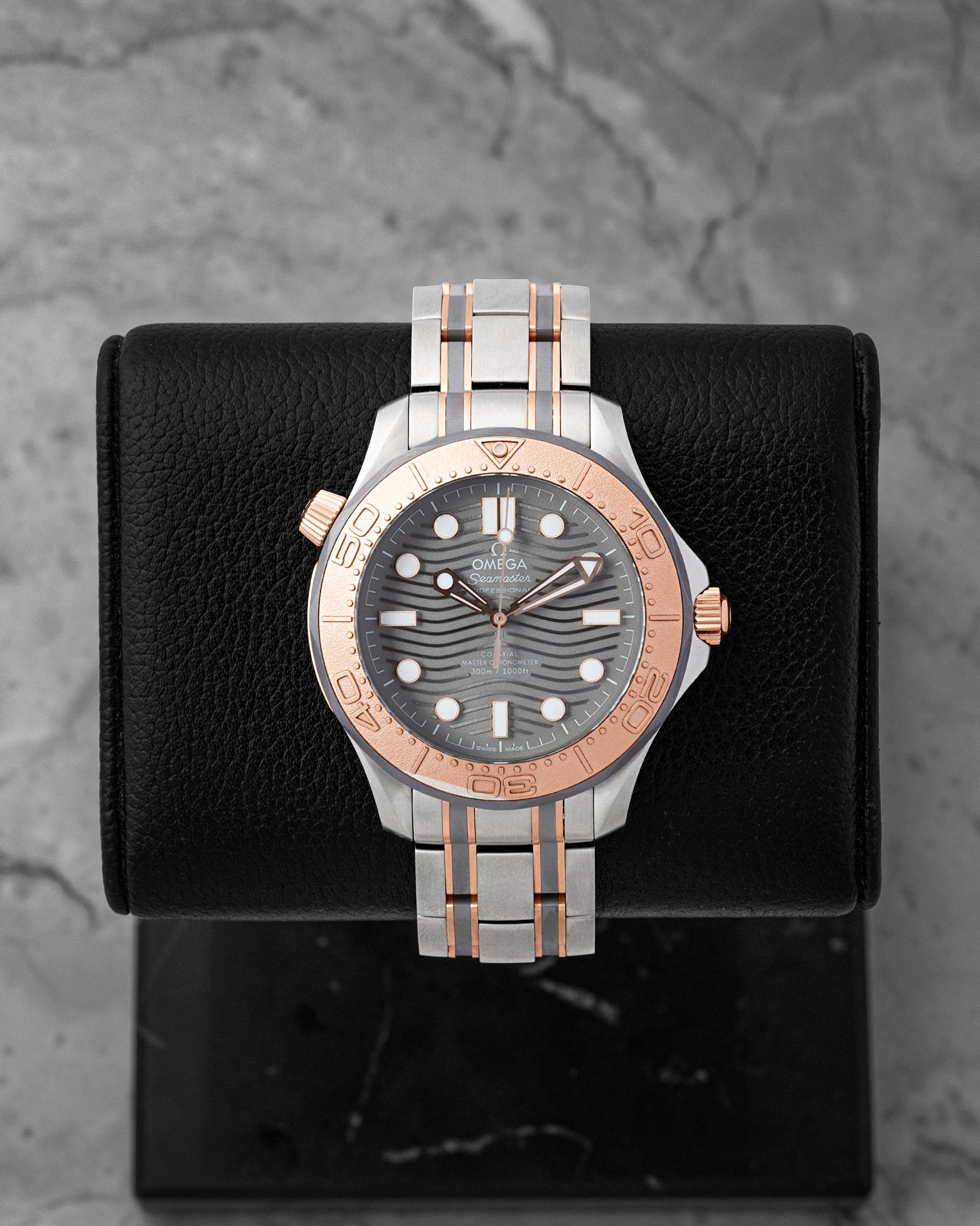 Pre-owned 2019 Omega Seamaster Diver 300M 210.60.42.20.99.001 titanium tantalum and Sedna gold watch at Noah's Fine Watches Dallas