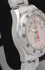 Left-side macro profile view showcasing the high-polished flowing case wall line and the iconic twisted lyre sports lugs flowing into the integrated three-row steel bracelet