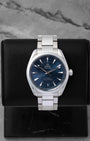 2022 pre-owned Omega Seamaster Aqua Terra 150M reference 220.10.41.21.03.004 featuring a blue horizontal teak-pattern dial and stainless steel bracelet, displayed on a watch cushion.