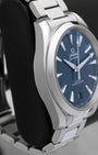 Left side profile view highlighting the twisted lyre lugs and polished stainless steel case edge of the Omega Aqua Terra 220.10.41.21.03.004.