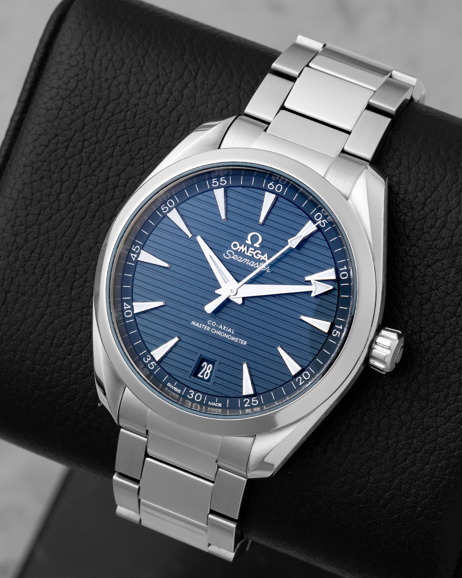 Angled shot of a pre-owned 2022 Omega Seamaster Aqua Terra 41mm showing the blue teak dial, date window at 6 o'clock, and brushed stainless steel bracelet.