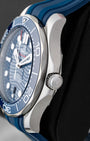 Right side view of the 2024 Omega Seamaster Diver 300M stainless steel case, crown guards, and blue ceramic bezel ring.