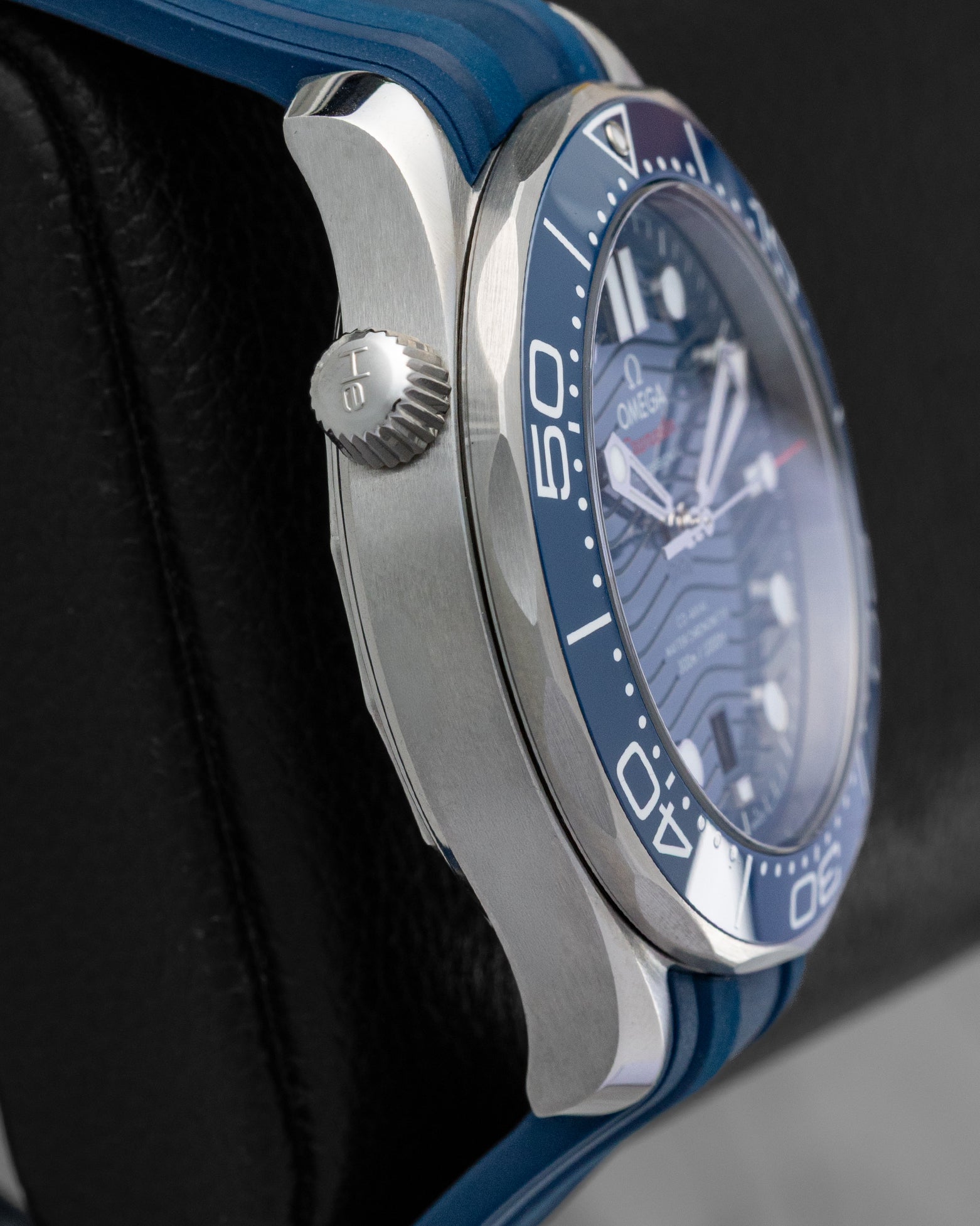 Left side profile view highlighting the conical helium escape valve at 10 o'clock on the 2024 Omega Seamaster Diver 300M.