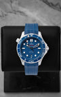 2022 Omega Seamaster Diver 300M reference 210.32.42.20.03.001 featuring a blue ceramic laser-engraved wave dial, ceramic bezel, and blue rubber strap.