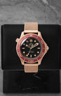 Omega Seamaster Diver 300M Bronze Gold 210.90.42.20.01.003 front view on display stand at Noah's Fine Watches & Jewelry Dallas
