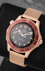 Angled view of Omega Seamaster Diver 300M 42mm Bronze Gold watch with burgundy bezel