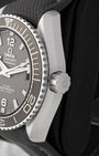 Close-up of the screw-down crown and coin-edge bezel on an Omega Seamaster Planet Ocean 600M