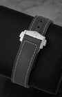 Integrated dark grey rubber strap with folding clasp engraved with the Omega logo