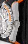 Close-up view of the screw-down crown and black ceramic bezel with orange rubber 15-minute diving scale