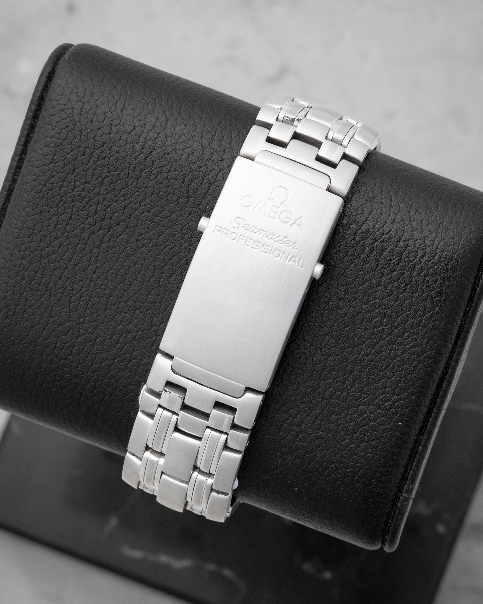 Rear studio view of the iconic 9-row stainless steel Seamaster link bracelet and brushed folding diver's clasp with extension