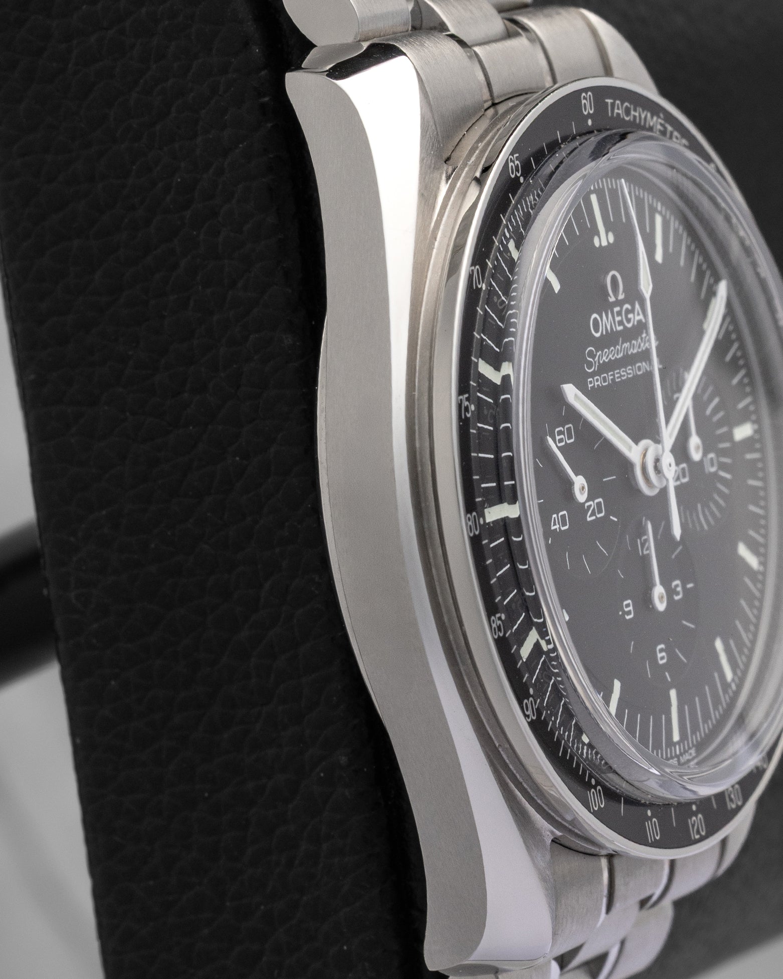 Polished and brushed 42mm stainless steel asymmetrical case side profile of Omega Speedmaster Moonwatch Professional