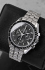 Angled view of pre-owned Omega Speedmaster Moonwatch Professional 310.30.42.50.01.002 featuring a black step dial and applied Omega logo