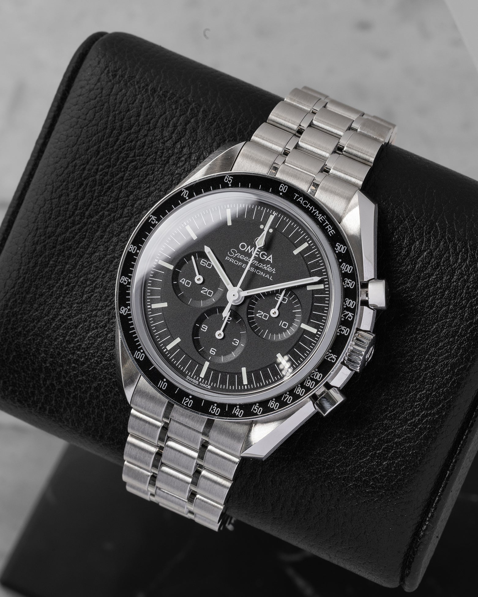 Angled view of pre-owned Omega Speedmaster Moonwatch Professional 310.30.42.50.01.002 featuring a black step dial and applied Omega logo