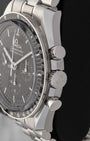 Side profile view showing the stainless steel case, winding crown, and chronograph pushers on Omega Speedmaster Moonwatch 310.30.42.50.01.002