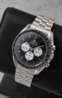 Angled view of preowned Omega Speedmaster Moonwatch Professional 310.30.42.50.01.004 featuring a black step dial with white sub-dials