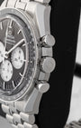 Side profile view displaying the stainless steel case, winding crown, and chronograph pushers on Omega Speedmaster Reverse Panda 310.30.42.50.01.004