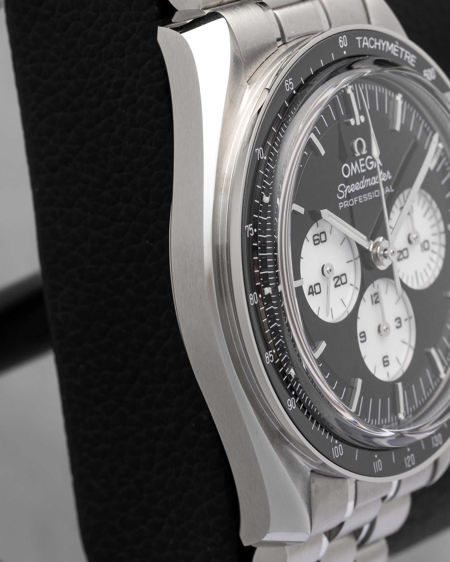 Polished and brushed 42mm stainless steel case side profile of pre-owned Omega Speedmaster Moonwatch Professional Reverse Panda