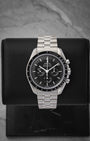 Pre-owned 2021 Omega Speedmaster Moonwatch Professional Sapphire Sandwich reference 310.30.42.50.01.002 with black step dial at Noah's Fine Watches & Jewelry in Dallas, Texas