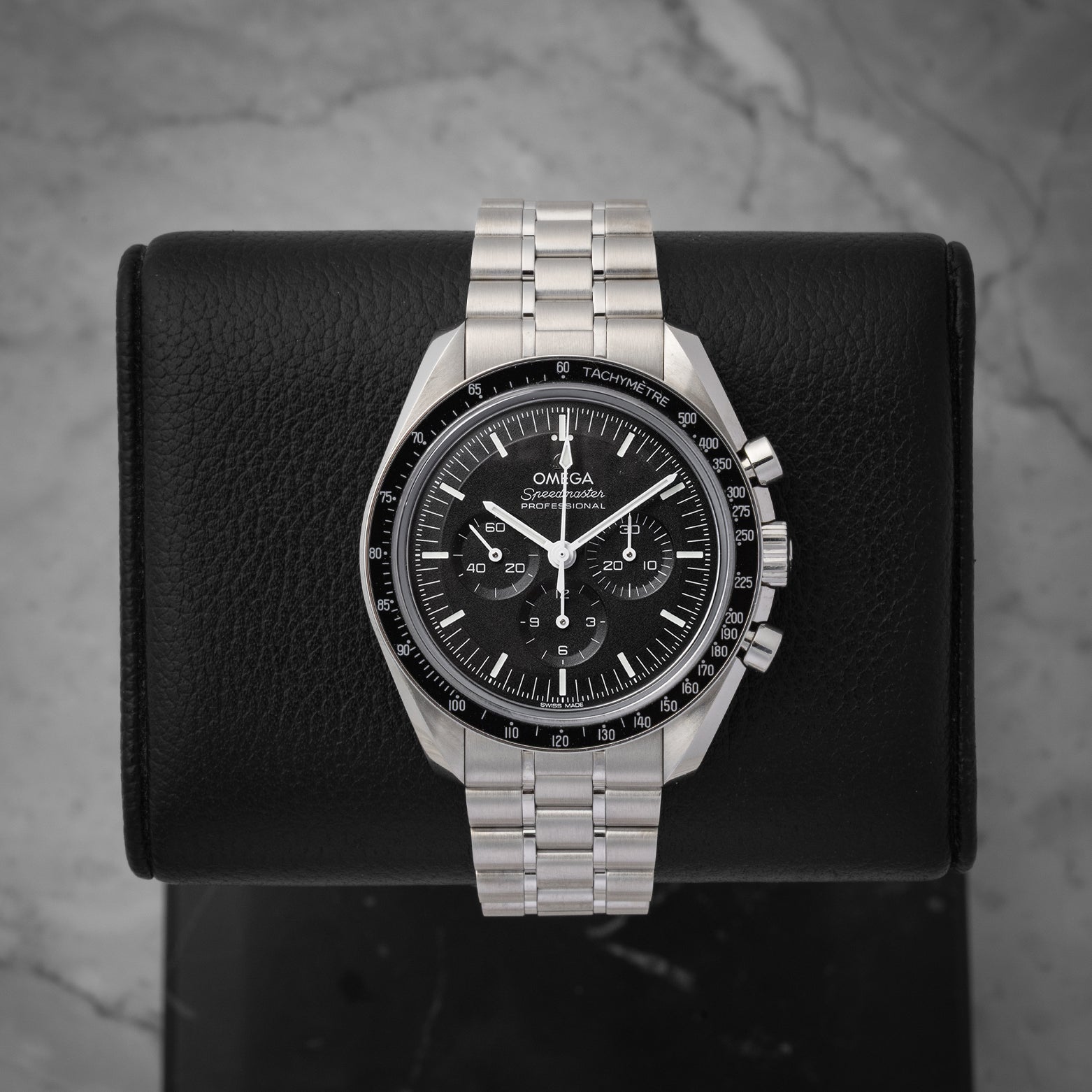 Pre-owned 2021 Omega Speedmaster Moonwatch Professional Sapphire Sandwich reference 310.30.42.50.01.002 with black step dial at Noah's Fine Watches & Jewelry in Dallas, Texas