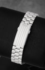 Fully brushed five-link stainless steel bracelet and micro-adjust clasp on an Omega Speedmaster Hesalite