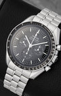Angled view of Omega Speedmaster Moonwatch Professional black step dial with dot-over-90 bezel