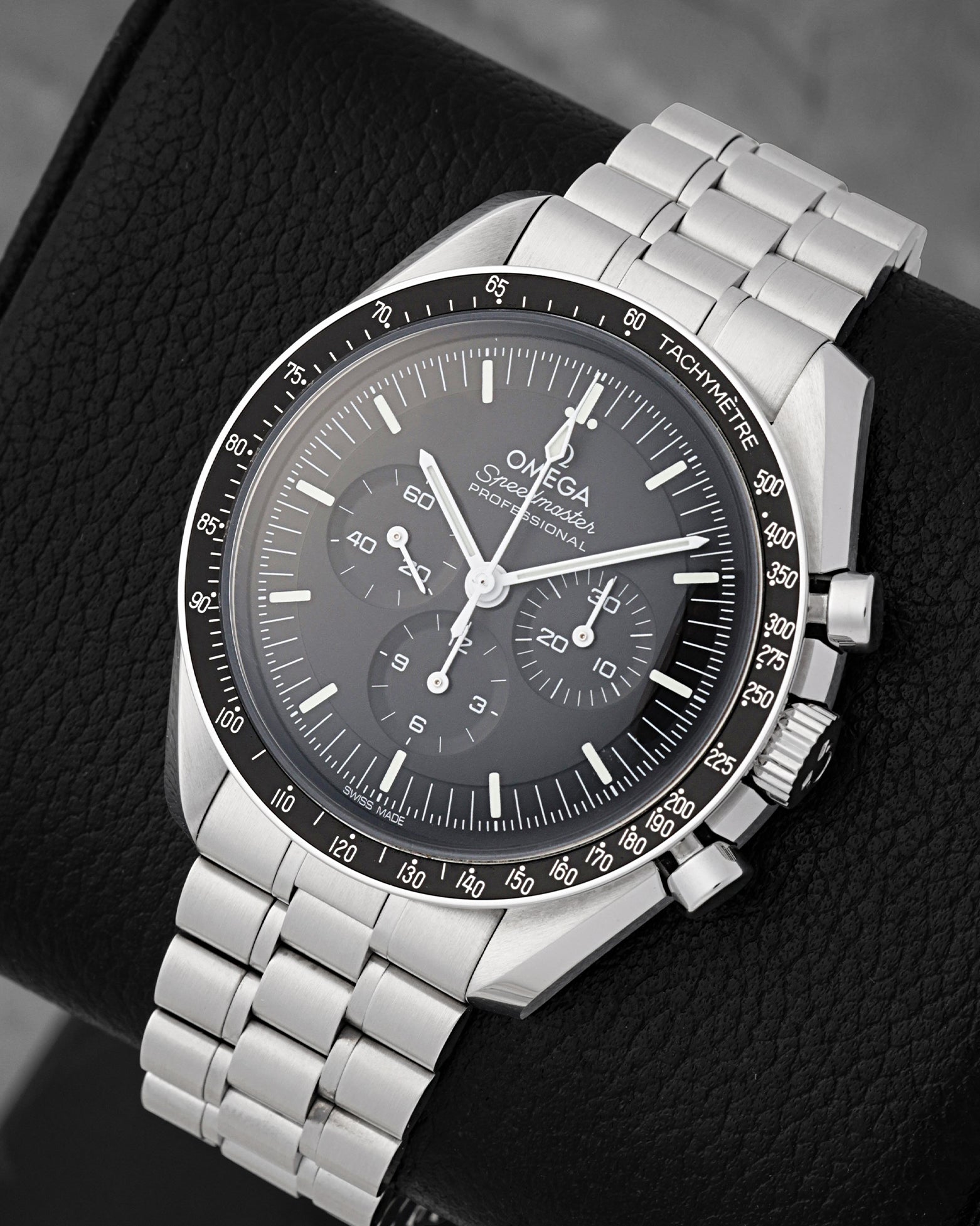 Angled view of Omega Speedmaster Moonwatch Professional black step dial with dot-over-90 bezel