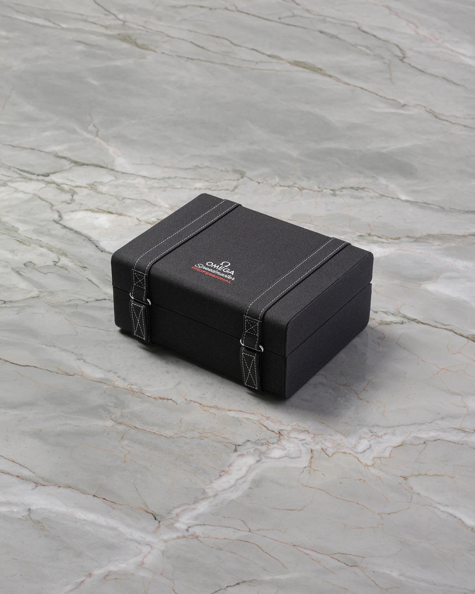 Official black Omega Speedmaster Moonwatch Professional suitcase-style presentation box at Noah's Fine Watches & Jewelry in Dallas