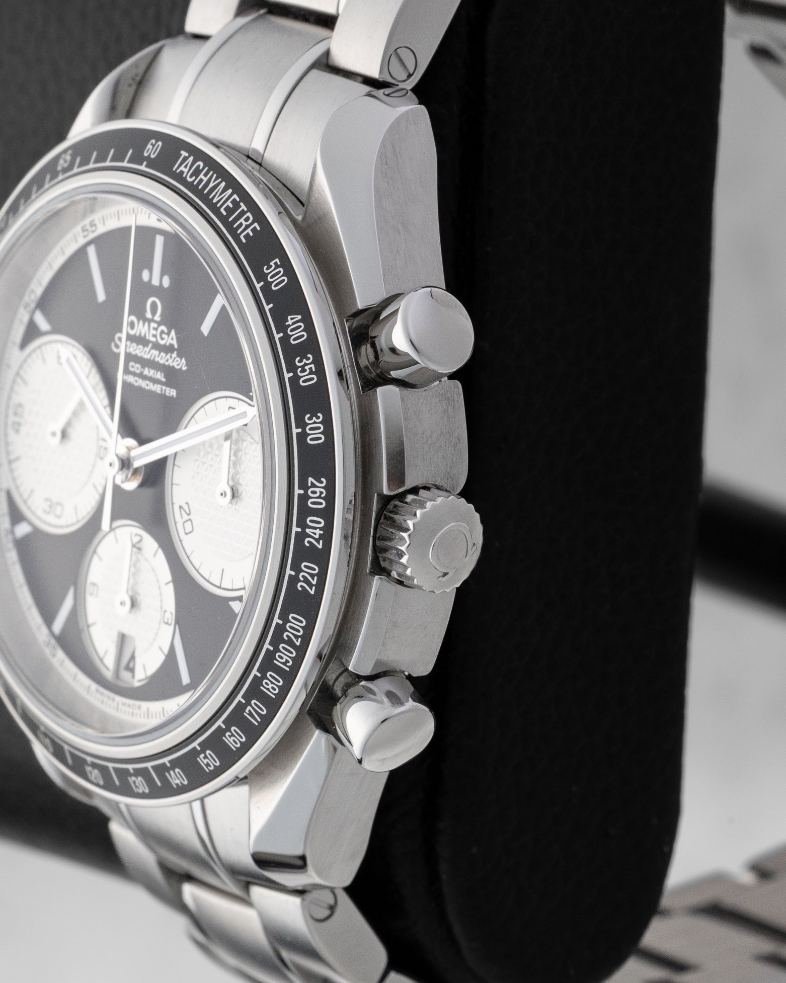 Side profile view of 40mm stainless steel case showing crown and chronograph pushers on Speedmaster Racing 326.30.40.50.01.002