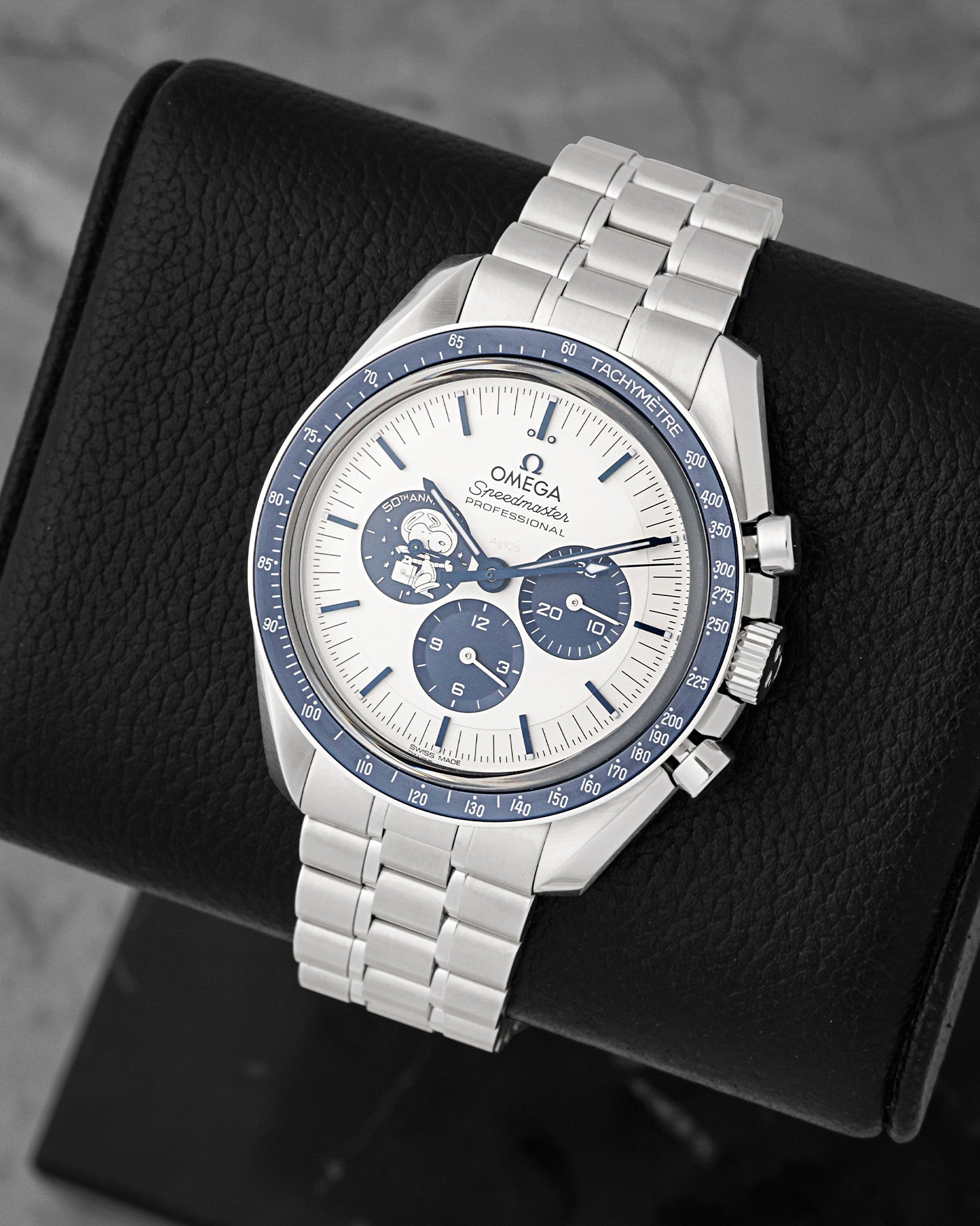 front view of Omega Speedmaster Silver Snoopy Award showing blue sub-dials, blue ceramic bezel, and steel bracelet