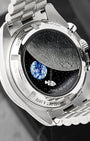 Detailed sapphire case back view featuring animated Snoopy in Command Module, rotating Earth disc, and lunar surface on Omega Speedmaster
