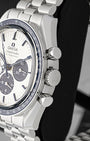 Side view close-up of the crown, chronograph pushers, and blue ceramic tachymeter bezel on Omega Speedmaster Snoopy 50th Anniversary