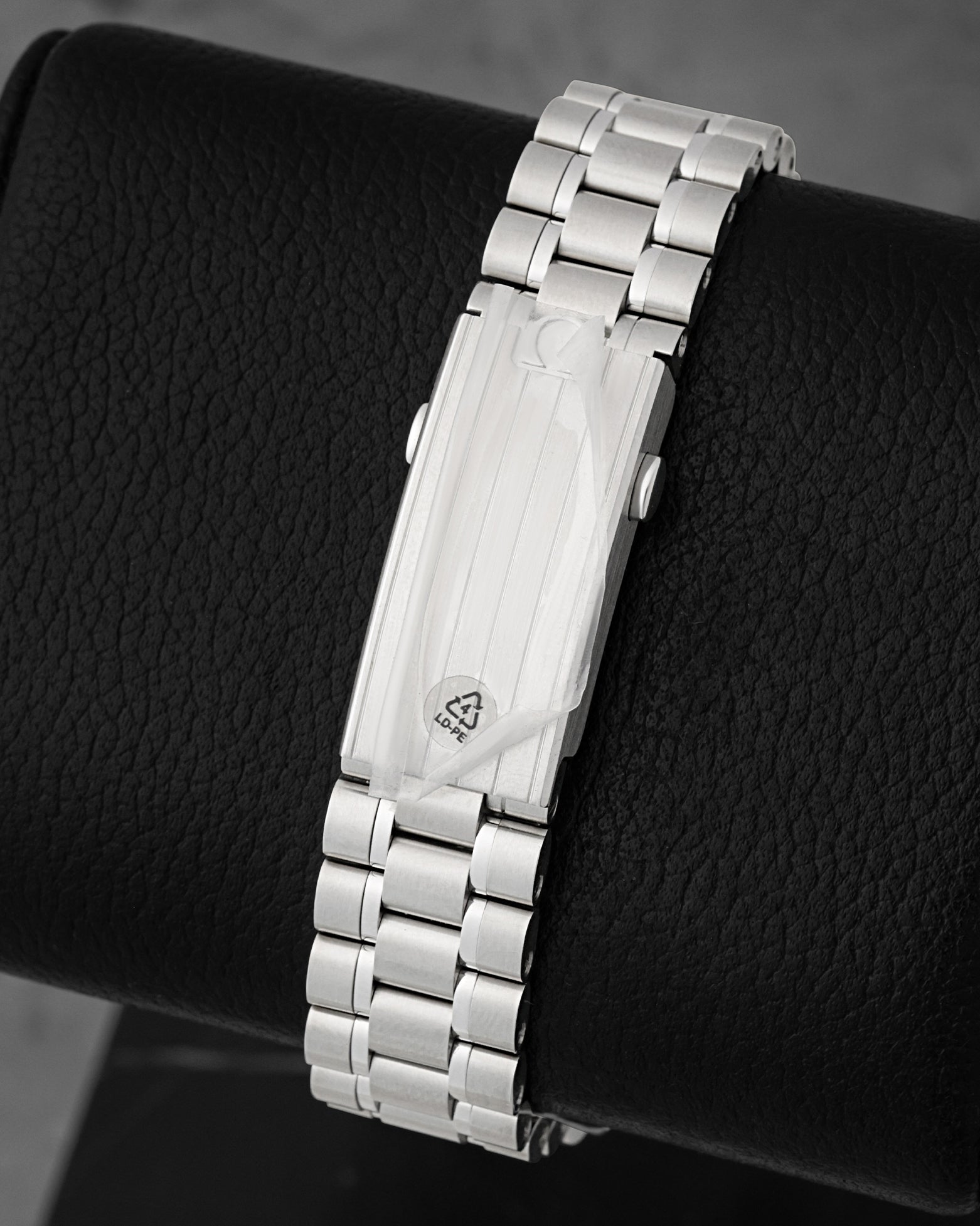 Close-up of the stainless steel bracelet and folding clasp on Omega Speedmaster Silver Snoopy Award