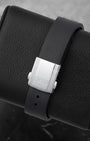 Black rubber Oris sign-molded strap paired with a brushed stainless steel folding security clasp and diver extension buttons